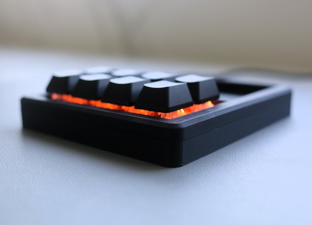 Core 8 tucked under a monitor with RGB lighting